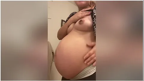 Preview supplied for Pregnant Milf Rubs Belly And Then Strips
