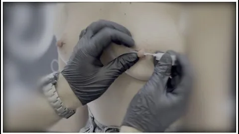 Preview supplied for Sexy Wife Piercing Her Nipples In A Piercing Studio. Close Up
