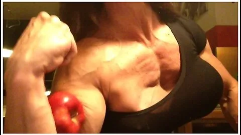 Preview supplied for Muscle Girl Destroys Bad Apple With Her Huge Bicep