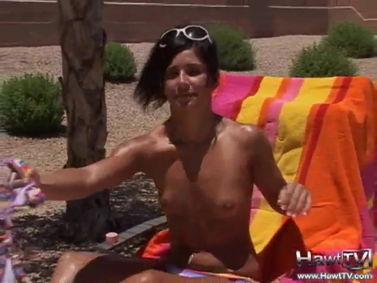 Preview supplied for Hot teen sunbathing outdoors in the hot sun